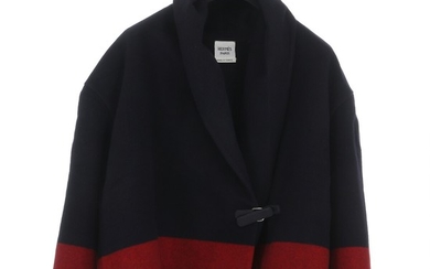 Hermès: A short navy jacket made of cashmere with a blue and a red stripe, a clasp on the front, two pockets and a collar. Size 34 (FR)