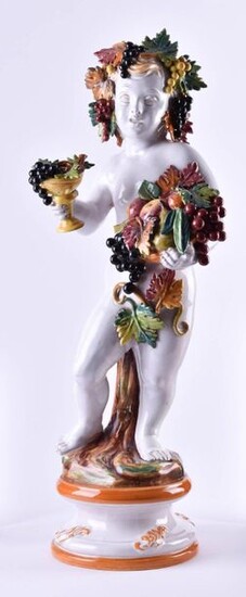 Large majolica figure | Large majolica figure,"Large bacchanalian child", colored painted with fruits and leaves, h: 73 cm_x000D_