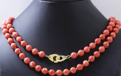 Long necklace composed of a row of coral...