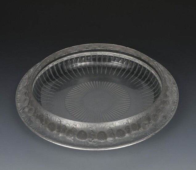 Marguerites' No.10-404 a Lalique clear and frosted glass bowl designed by Rene Lalique, cast with a frieze of flowerheads to the rim, and a modern Lalique Festons four piece chemin de table, stencil Lalique France mark, 35cm. diam. (5)