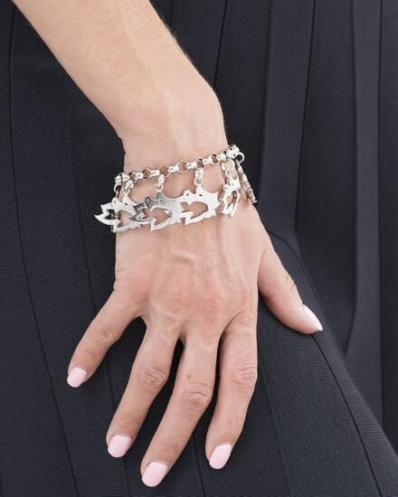 Marina B, bracelet argent retenant des charms ajourés, signé, numéroté 5105001, long. 17.5 cm
