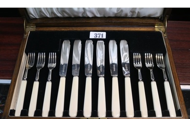 Oak Cased Canteen of Silver bladed flatware with Bone handle...