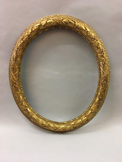 *Oval carved and gilded wood frame