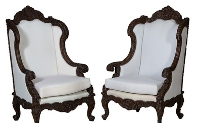 Pair of Anglo-Colonial Style Mahogany Wing Chairs, 20th/21st c., with arched foliate and floral