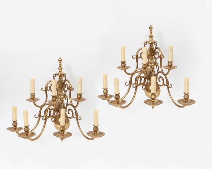 Pair of brass sconces with seven coiled light arms.