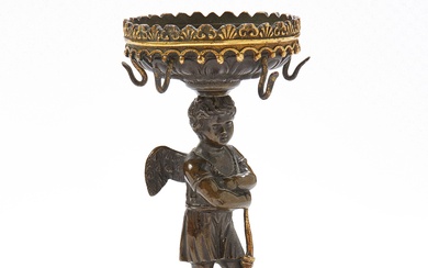 Porte-montre en bronze à double patine, à décor de Cupidon accoudé sur son arc Travail...