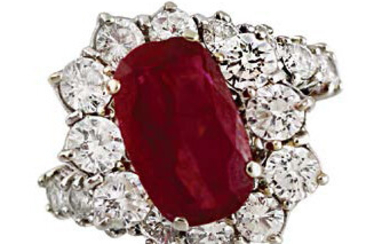 RING in white gold with oval ruby weighing...