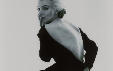 STERN, BERT (1929-2013) Marilyn Monroe in black Dior dress