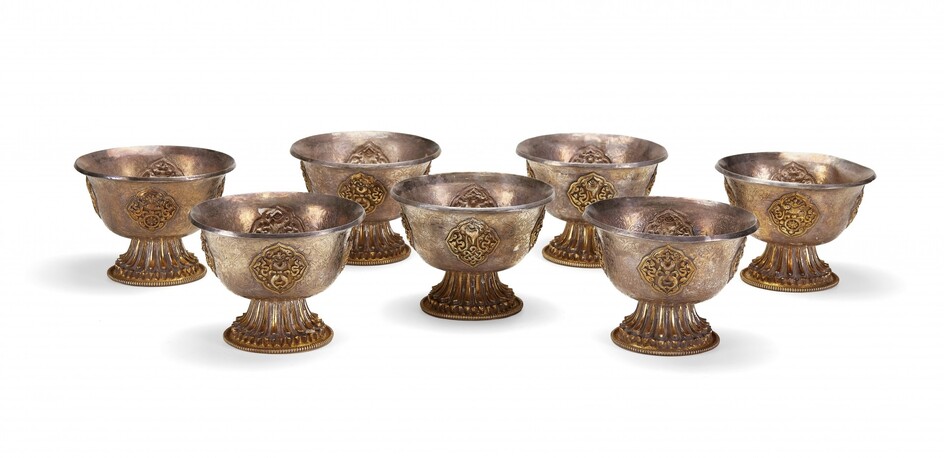 Seven moulded silver buddhist stem cups Tibet, early 20th Century