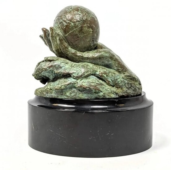 Signed Bronze Figural Sculpture. Hand holding world glo