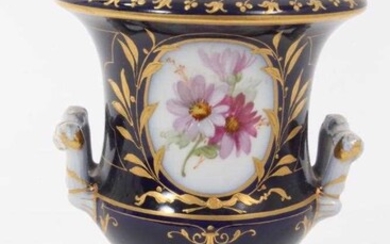 Small Berlin porcelain campana vase, circa 1880, painted with flowers on a gilt and cobalt blue ground, marks to base, 9.75cm high