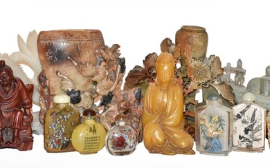 A collection of 20th century Oriental soapstone carvings decorated...