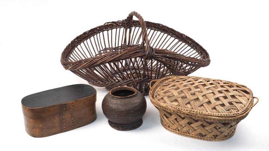 Three bentwood boxes, early 20th largest 67.5cm wide, together with; two wicker baskets, largest 76cm wide, and a woven bowl. (6)