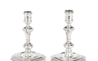Two George II cast silver candlesticks