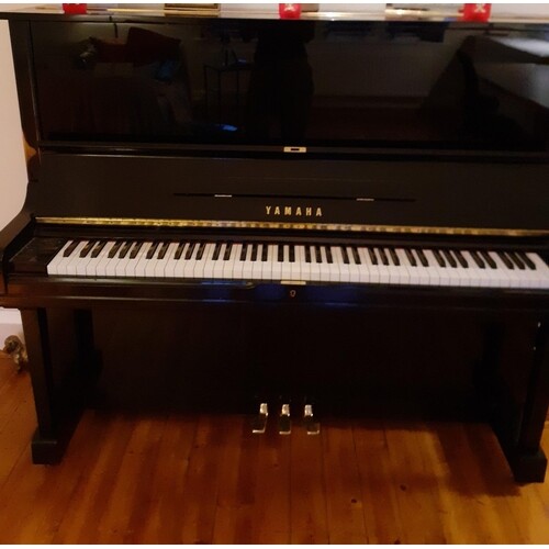 Yamaha (c1978) A Model U3 upright piano in a bright ebonised...