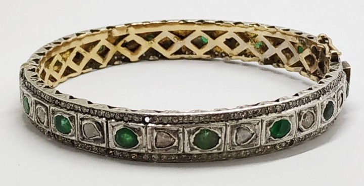 gold silver emerald and diamond bracelet.