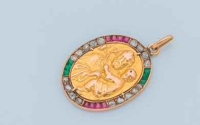 18 karat (750 thousandths) yellow gold pendant depicting Saint Joseph carrying the Christ child, in a setting of rubies and calibrated emeralds, interspersed with rose-cut diamonds.