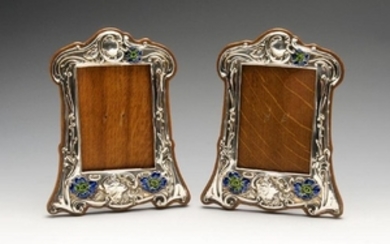 A pair of Art Nouveau silver mounted photograph frames