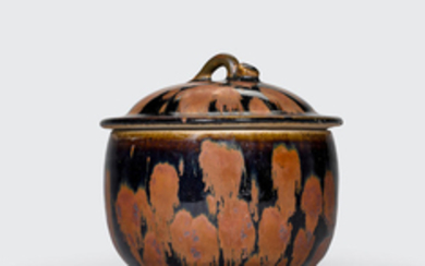 A black and russet-splashed deep bowl and cover