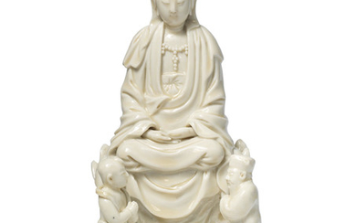 A blanc-de-Chine figure of Guanyin and acolytes