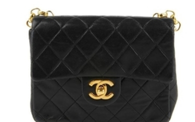 CHANEL - a black vintage Mini Classic Flap handbag.