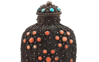 CHINESE INLAID BRASS SNUFF BOTTLE In ovoid form, with a stylized floral design inlaid with coral and turquoise. Height 2.75". Confor...