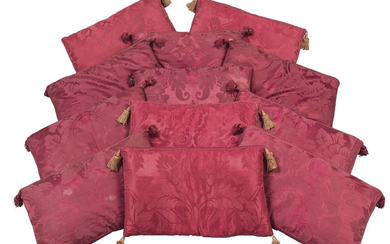 A GROUP OF TWELVE RED DAMASK CUSHIONS, THE DAMASK 18TH CENTURY