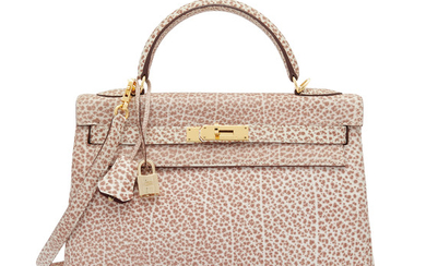 A LIMITED EDITION ROUGE H & WHITE BUFFALO LEATHER DALMATIEN RETOURNÉ KELLY 32 WITH GOLD HARDWARE, HERMÈS, 2001