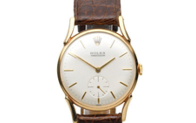 Rolex. A 9K gold manual wind wristwatch