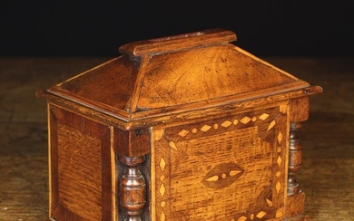 A 19th Century Welsh Inlaid Wooden Money Box. The bevelled walnut top centred by a large coin slot.