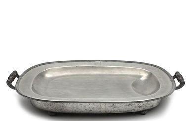 A 19th century English pewter warming platter raised on four feet, with...