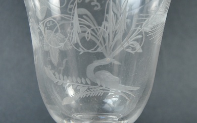 A 19th century engraved glass coin goblet. The cup bowl decorated with floral motifs, with the monogram A M, on a knop stem and circular foot. Silver coin dated 1839. Approximately 14cm tall, diameter 11cm.