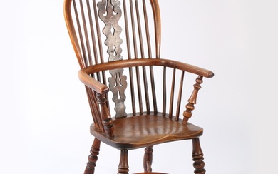 A 19th century yew and elm Windsor armchair, Nottinghamshire...
