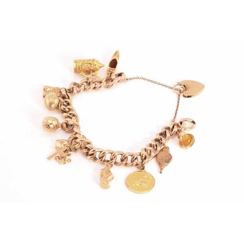 A 9ct gold charm bracelet, consisting of a hollow rose gold ...