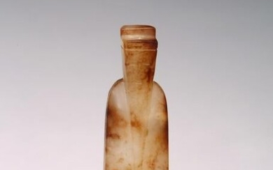 A CHINESE ARCHAIC JADE FIGURE OF AN OFFICIAL