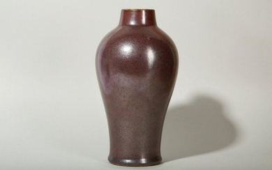 A CHINESE IRON RUST GLAZED VASE, MEIPING. Qing Dynasty, 18th Century. The high vase rising to swelling shoulders and a tapering neck, covered evenly in a rich, silvery reddish-brown glaze, the base recessed and similarly glazed save for the foot ring...