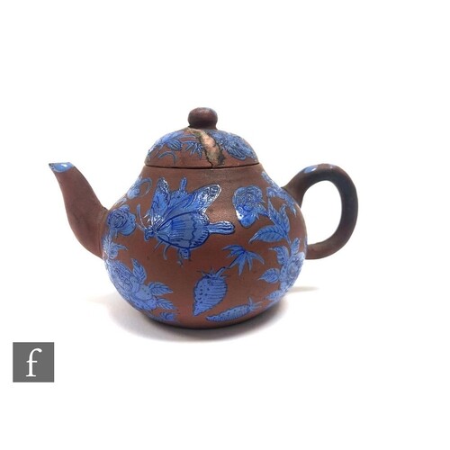A Chinese 19th Century Yixing enamelled teapot of rounded fo...