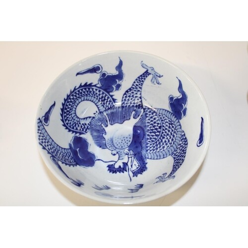 A Chinese blue & white bowl with dragon decoration & marks t...
