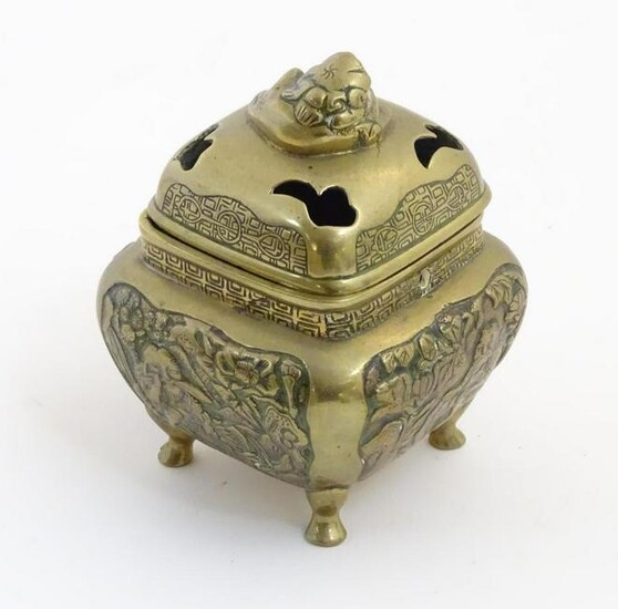 A Chinese lidded cast brass censor of squat form with