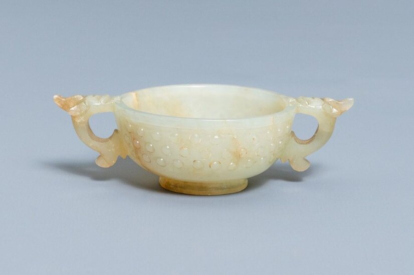 A Chinese pale celadon and russet jade two...