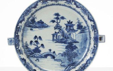 A Chinese porcelain heating plate, second half of the 18th century, decorated in underglaze blue of river landscape with pagodas.