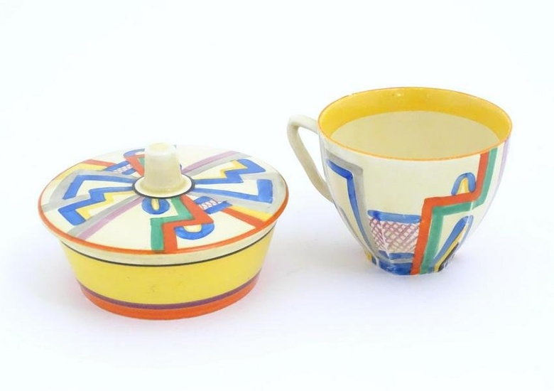 A Clarice Cliff pot of circular form decorated in the Tennis pattern with associated lid. Together