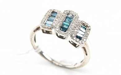 A DIAMOND AND BLUE STONE DRESS RING IN STERLING SILVER