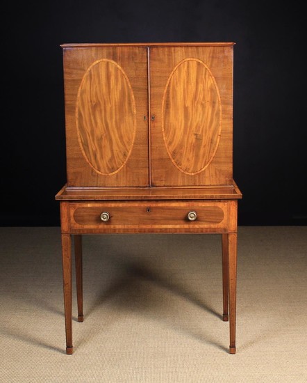 A Fine George III Mahogany Writing Desk with Bookcase top in the Sheraton Style, inlaid with satinwo
