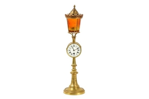 A LATE 19TH CENTURY GILT BRASS AND GLASS NOVELTY CLOCK