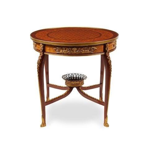 A LOUIS XVI STYLE GILT BRONZE MOUNTED PARQUETRY TABLE
