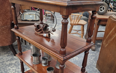 A VICTORIAN MAHOGANY FOUR TIER BUFFET WITH FOLIATE CARVED THREE QUARTER GALLERIED TOP