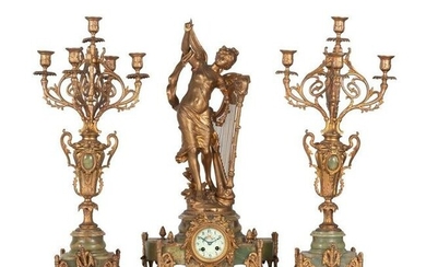 A Neoclassical Gilt Metal and Onyx Clock Garniture