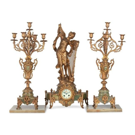 A Neoclassical Gilt Metal and Onyx Clock Garniture