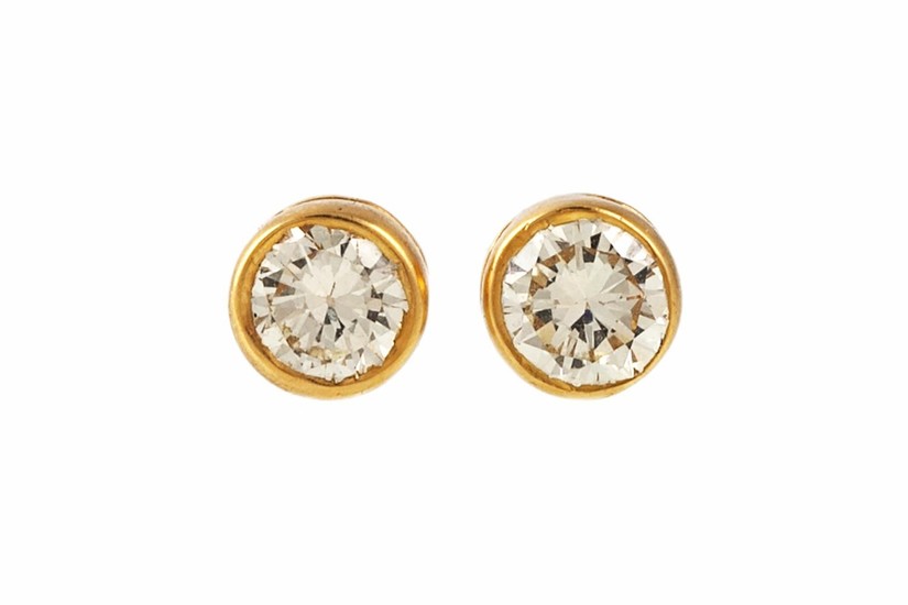 A PAIR OF DIAMOND SOLITAIRE STUD EARRINGS, with diamonds of ...